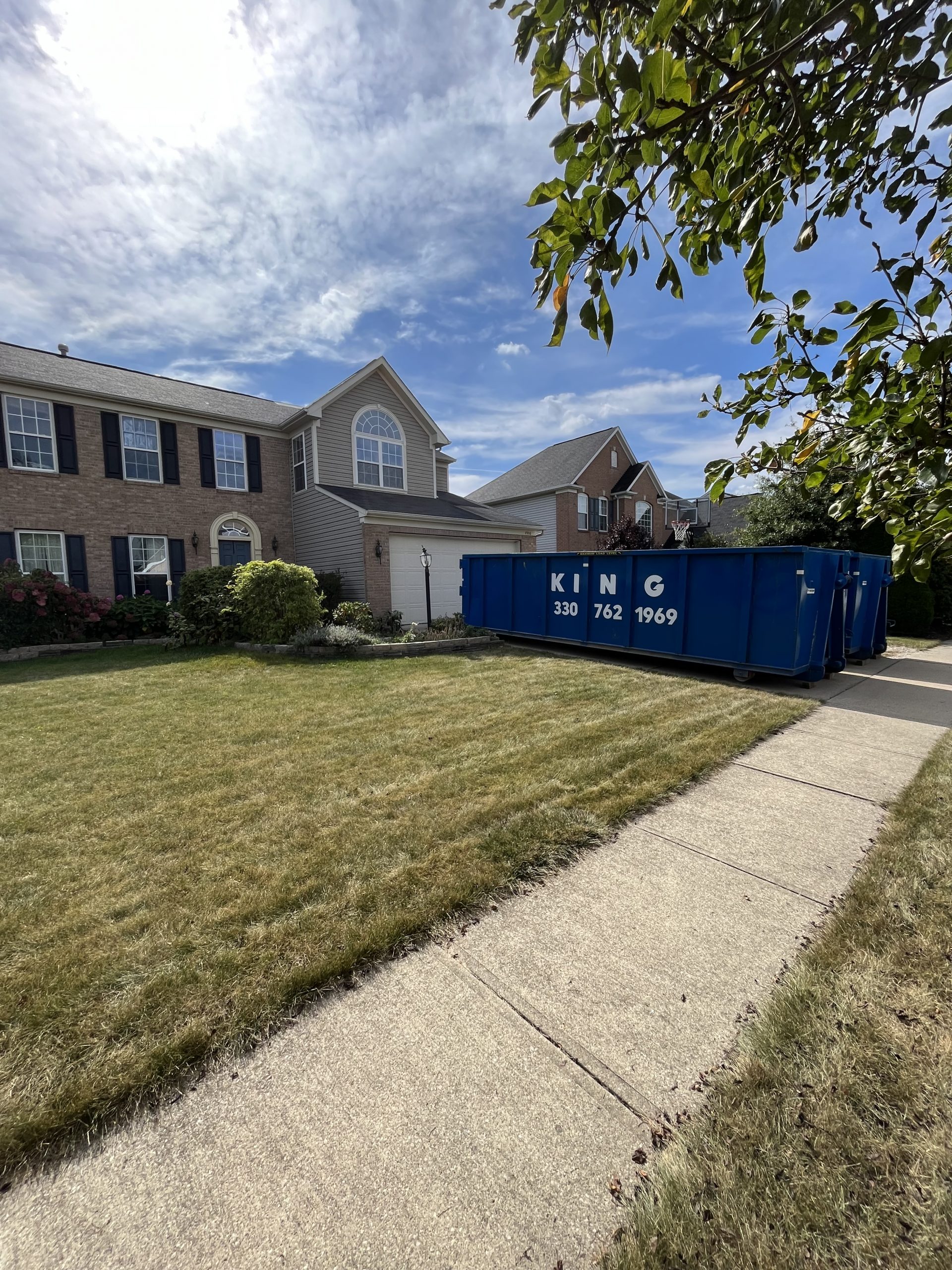 30 cubic yard roll off dumpster in driveway
