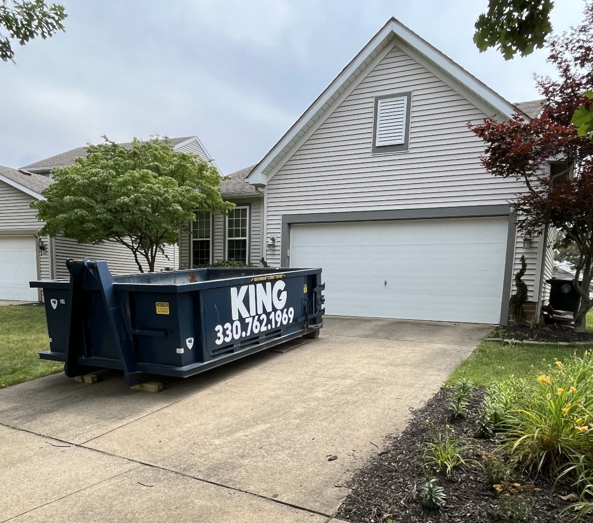 Roll Off Dumpster in Cleveland Driveway